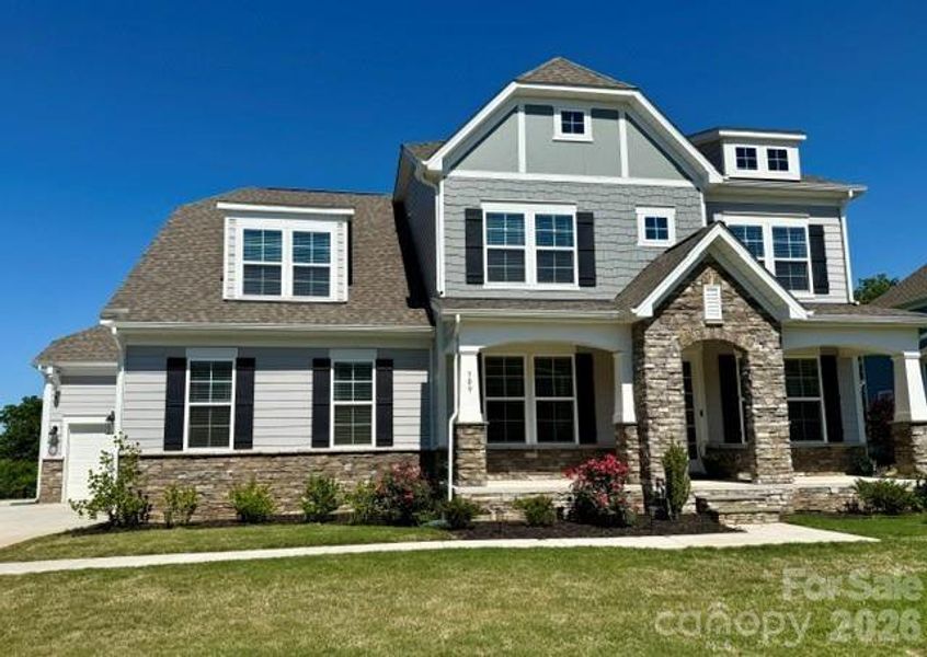 Front exterior of a new home in Legacy at Reid's Cove, Mooresville, NC, highlighting curb appeal (Image 2). Front exterior of a new home in Legacy at Reid's Cove, Mooresville, NC, highlighting curb appeal (Image 2).