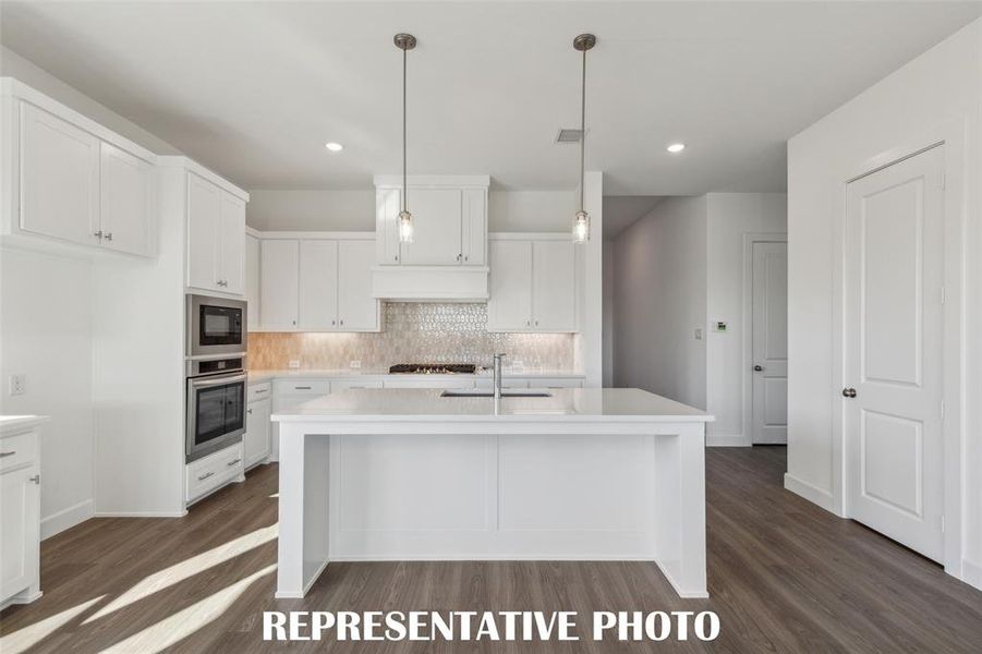 A spacious island is the hub of your new dream kitchen and offers the perfect place for friends and family to gather round!  REPRESENTATIVE PHOTO