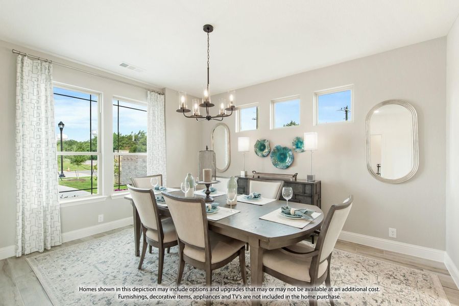 Dining room with six-chair wooden table, chandelier, and large windows with garden views Dining room with six-chair wooden table, chandelier, and large windows with garden views