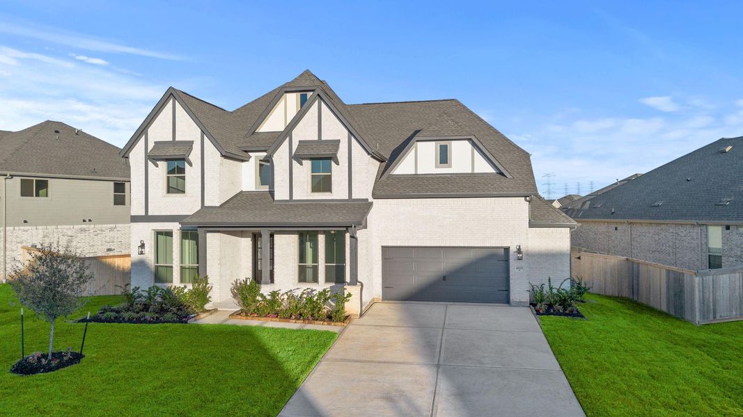 Front exterior of a new home in Coastal Point, League City, TX, highlighting curb appeal (Image 18). Front exterior of a new home in Coastal Point, League City, TX, highlighting curb appeal (Image 18).