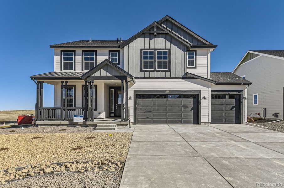 Front exterior of a new home in Independence: The Grand Collection, Elizabeth, CO, highlighting curb appeal (Image 1). Front exterior of a new home in Independence: The Grand Collection, Elizabeth, CO, highlighting curb appeal (Image 1).