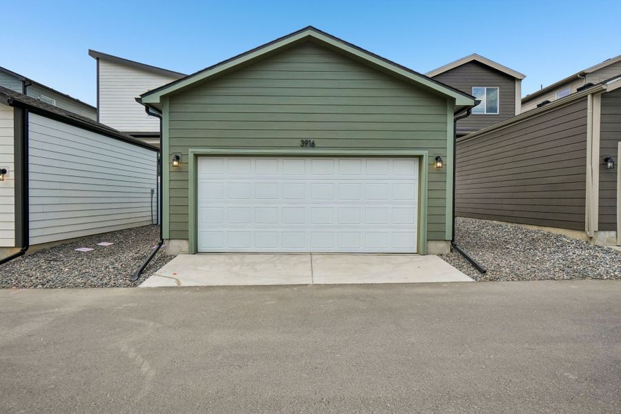 Front exterior of a new home in Liberty Draw, Evans, CO, highlighting curb appeal (Image 22).