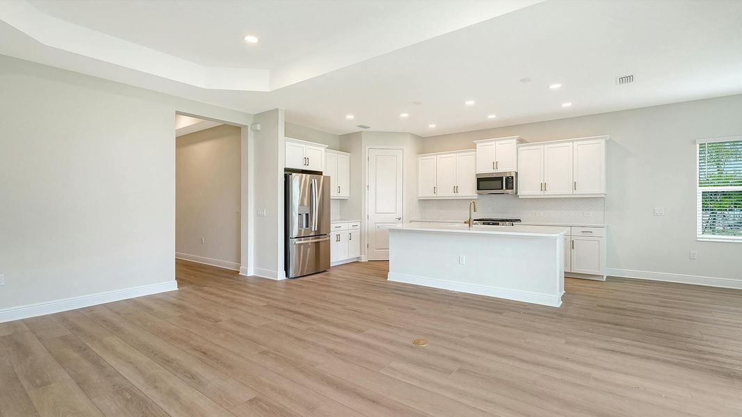 Spacious, unfurnished interior of a new home in Wildleaf Real Estate and Homes for Sale in Parrish, FL - Neal Communities, Parrish (Image 15).