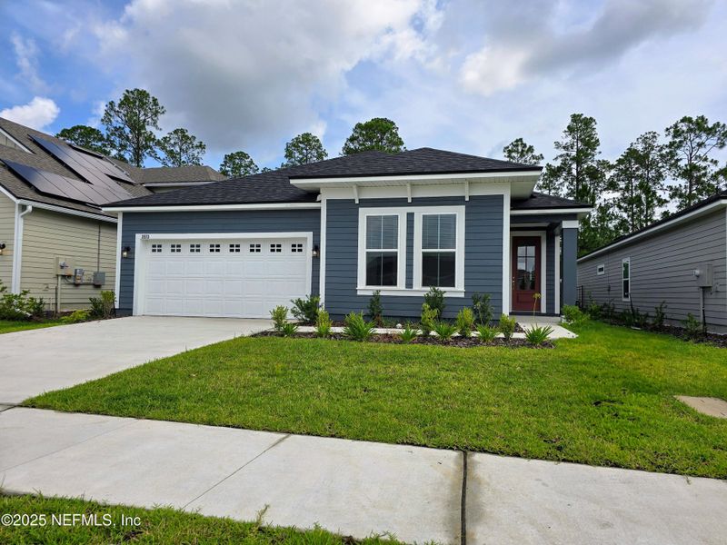 Front exterior of a new home in Hyland Trail, Middleburg, FL, highlighting curb appeal (Image 2).