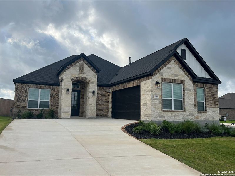 Front exterior of a new home in , Castroville, TX, highlighting curb appeal (Image 14). Front exterior of a new home in , Castroville, TX, highlighting curb appeal (Image 14).