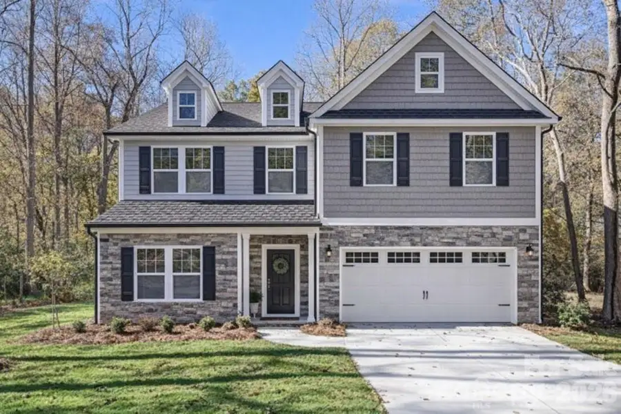 Front exterior of a new home in , Matthews, NC, highlighting curb appeal (Image 2). Front exterior of a new home in , Matthews, NC, highlighting curb appeal (Image 2).