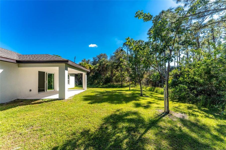 Exterior details and patio area of a home in , North Port (Image 29).