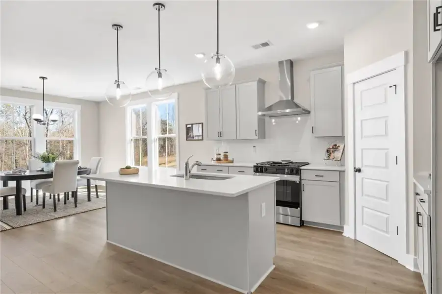 This bright kitchen features a spacious island and