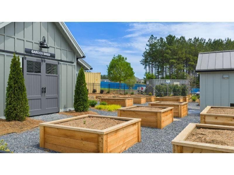 Exterior details and patio area of a home in Soleil Belmont Park, Canton (Image 31).