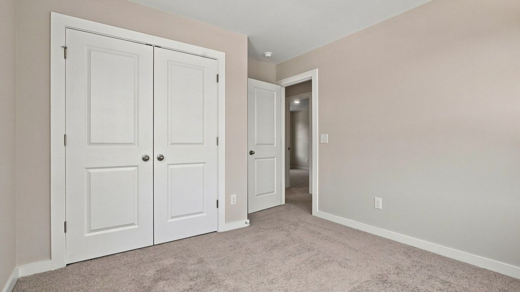 Secondary bedroom view from windows of closet and room entrance Secondary bedroom view from windows of closet and room entrance