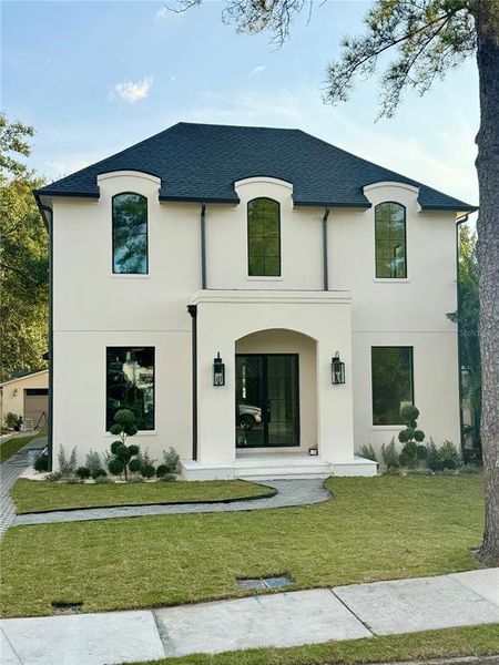 Front exterior of a new home in , Tampa, FL, highlighting curb appeal (Image 1).