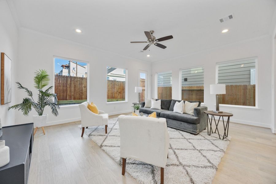 Clean Lines & Cozy VibesA closer look at the living room highlights the thoughtful design—plenty of room for a media setup or statement artwork, plus natural light that changes with the day.
