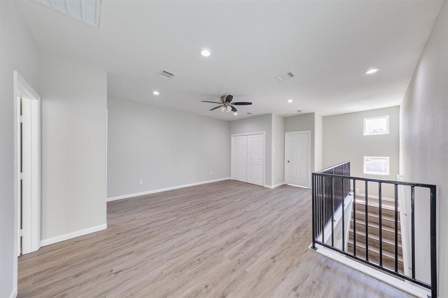 This floor also features two comfortable bedrooms, a full bathroom, and a convenient utility room, offering a well-rounded living space. Whether you’re looking for a cozy retreat or a lively area for activities, this level has everything you need for modern living.