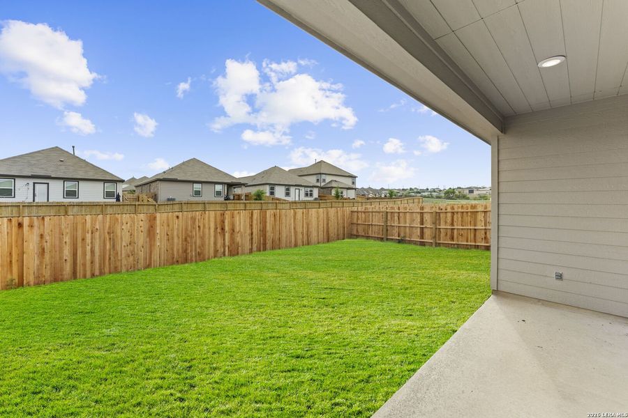 Exterior details and patio area of a home in Hightop Ridge, Converse (Image 2).