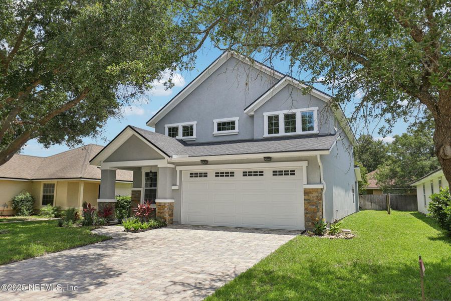 Front exterior of a new home in , Orange Park, FL, highlighting curb appeal (Image 28). Front exterior of a new home in , Orange Park, FL, highlighting curb appeal (Image 28).