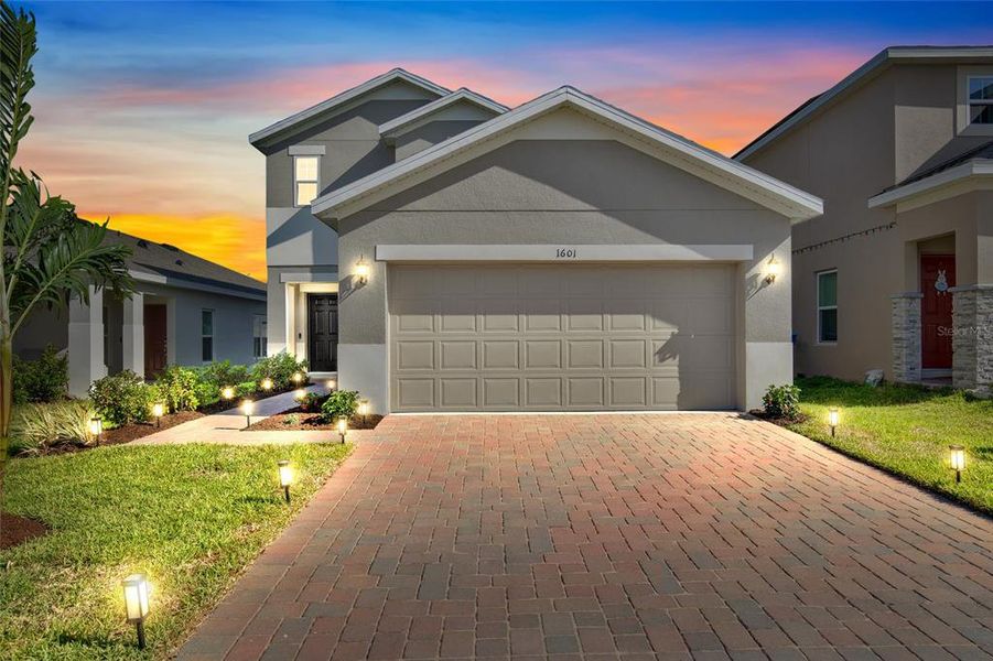Front exterior of a new home in Horse Creek at Crosswinds, Davenport, FL, highlighting curb appeal (Image 1). Front exterior of a new home in Horse Creek at Crosswinds, Davenport, FL, highlighting curb appeal (Image 1).