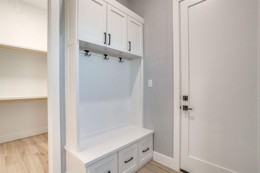Mudroom featuring light wood-style flooring