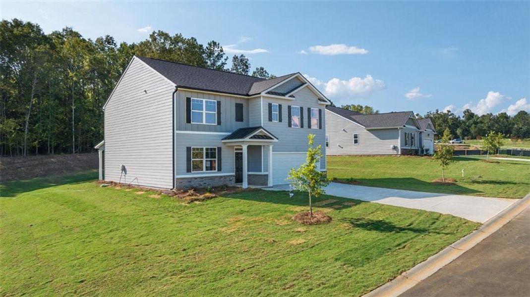 Front exterior of a new home in Kingston Ranch at Lake Oconee, Buckhead, GA, highlighting curb appeal (Image 1). Front exterior of a new home in Kingston Ranch at Lake Oconee, Buckhead, GA, highlighting curb appeal (Image 1).