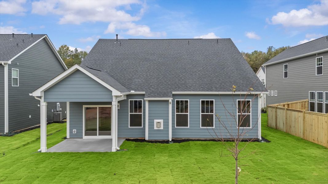 Refined rear exterior with a stylish covered porch for dining, relaxing, or entertaining Refined rear exterior with a stylish covered porch for dining, relaxing, or entertaining