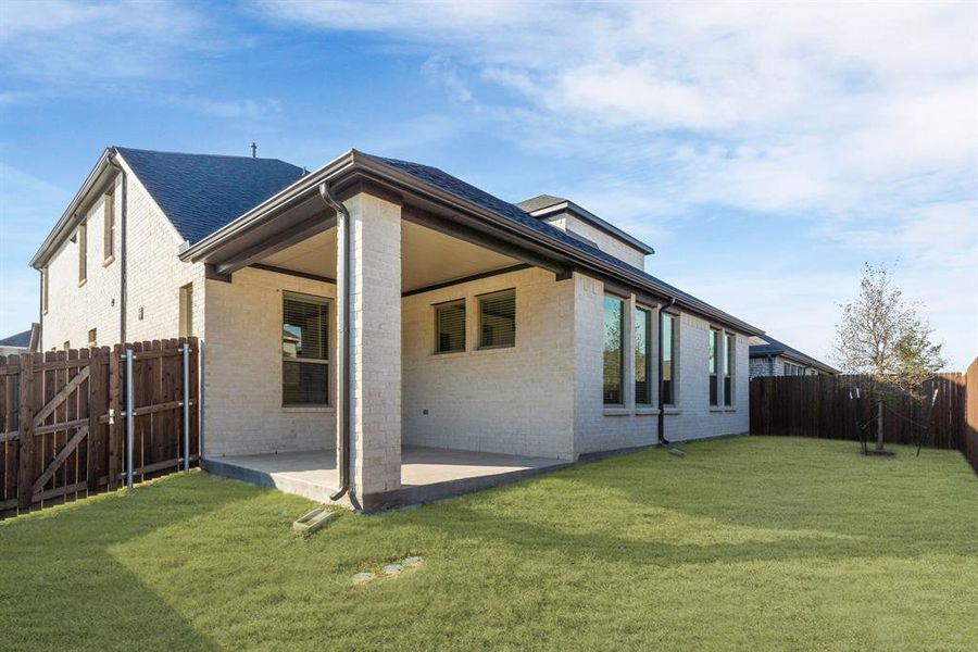Exterior details and patio area of a home in Wolf Creek Farms, Melissa (Image 3).