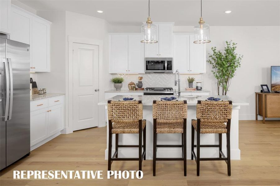 Classic finishes, beautiful cabinetry and fantastic space...any chef would be proud to call this kitchen their own! REPRESENTATIVE PHOTO