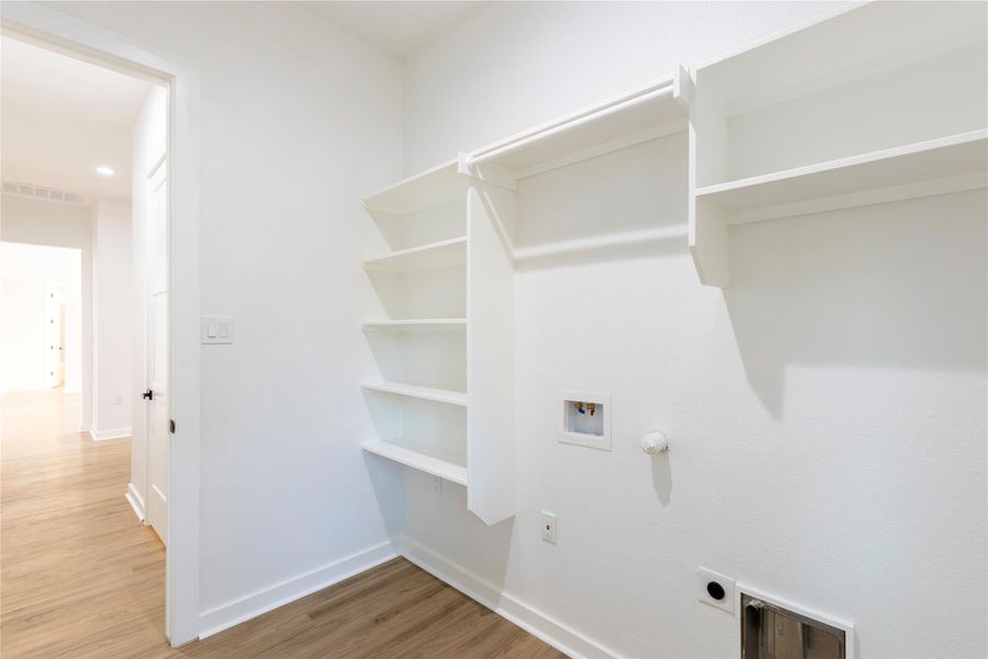 Utility room with direct access to the hall.