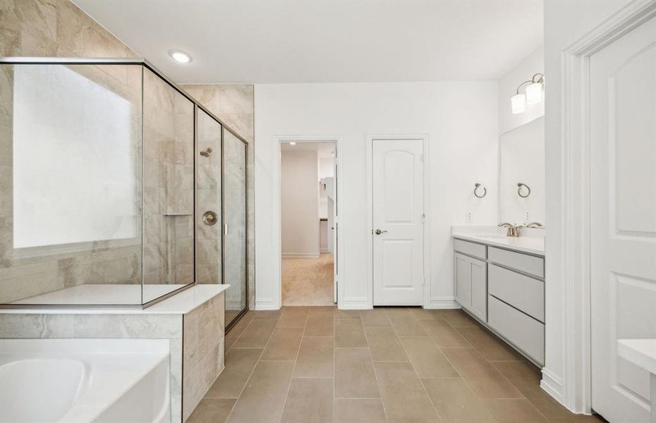 Spacious owner's bathroom*real home pictured