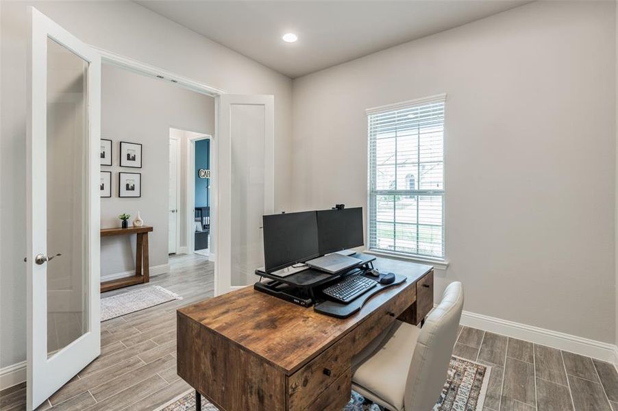 Office area featuring hardwood / wood-style flooring