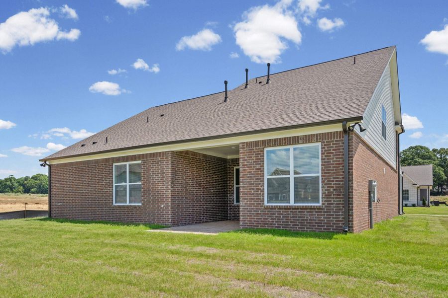 Brick exterior with contrasting siding accents, dark shingle roof, and white-framed windows Brick exterior with contrasting siding accents, dark shingle roof, and white-framed windows