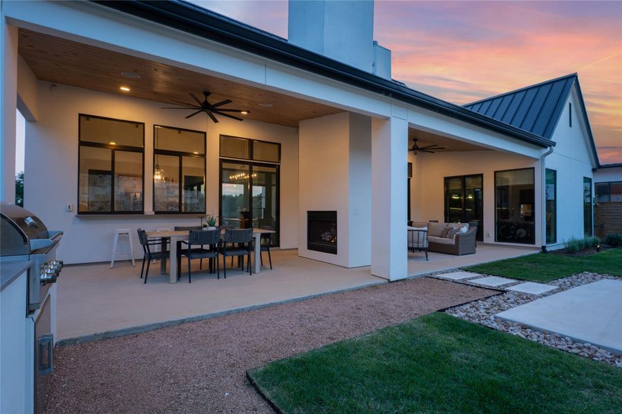 Expansive covered patio featuring a wood-finish ceiling, recessed lighting, and ceiling fans Expansive covered patio featuring a wood-finish ceiling, recessed lighting, and ceiling fans