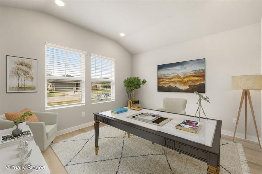 Quietly nestled in front of the home is the handsome home office. Featuring luxury vinyl plank floors, high ceilings, large windows with privacy blinds and neutral paint.