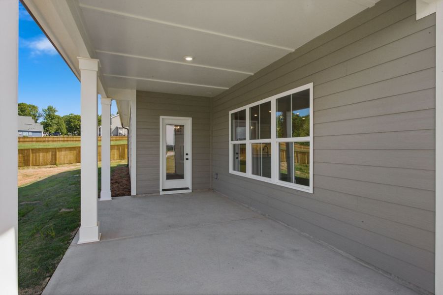 Exterior details and patio area of a home in Cherokee Knoll, Williamston (Image 4).
