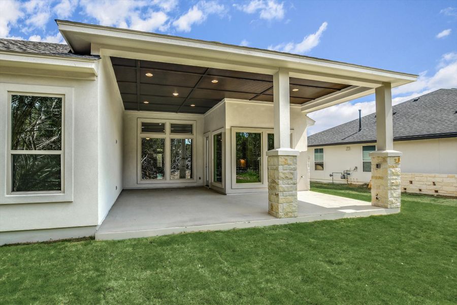 Exterior details and patio area of a home in The Hollows, Jonestown (Image 3).