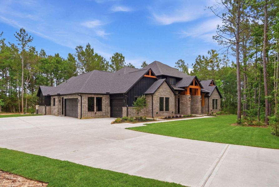 Front exterior of a new home in , Montgomery, TX, highlighting curb appeal (Image 27).