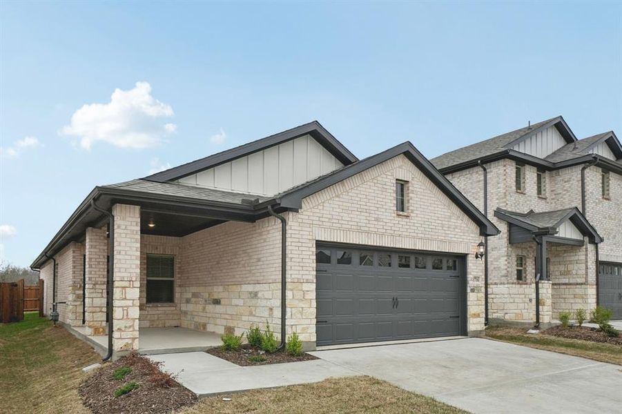 Front exterior of a new home in Parks at Foster Crossing - Spring Series, Anna, TX, highlighting curb appeal (Image 22).