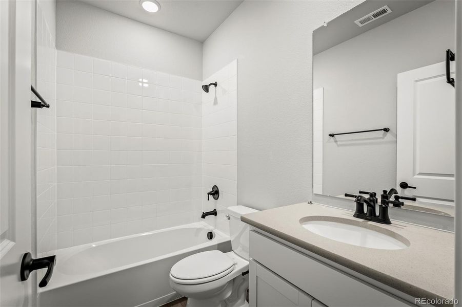 Furnished interior view inside a new home in Revel Crossing at Wolf Ranch – The Outlook Collection, Colorado Springs (Image 19).