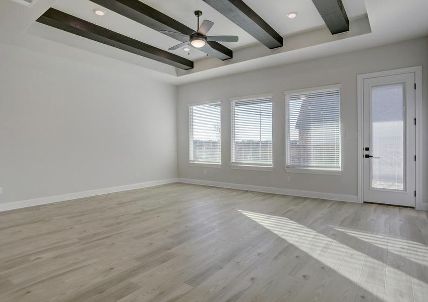 Large, open living room with lots of windows creates a bright space.