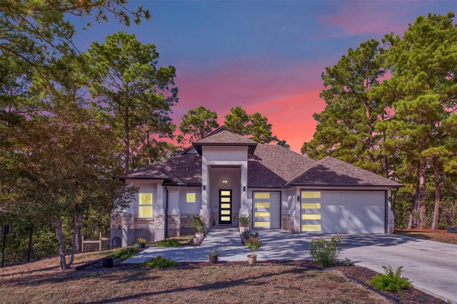 Front exterior of a new home in , Bastrop, TX, highlighting curb appeal (Image 1).