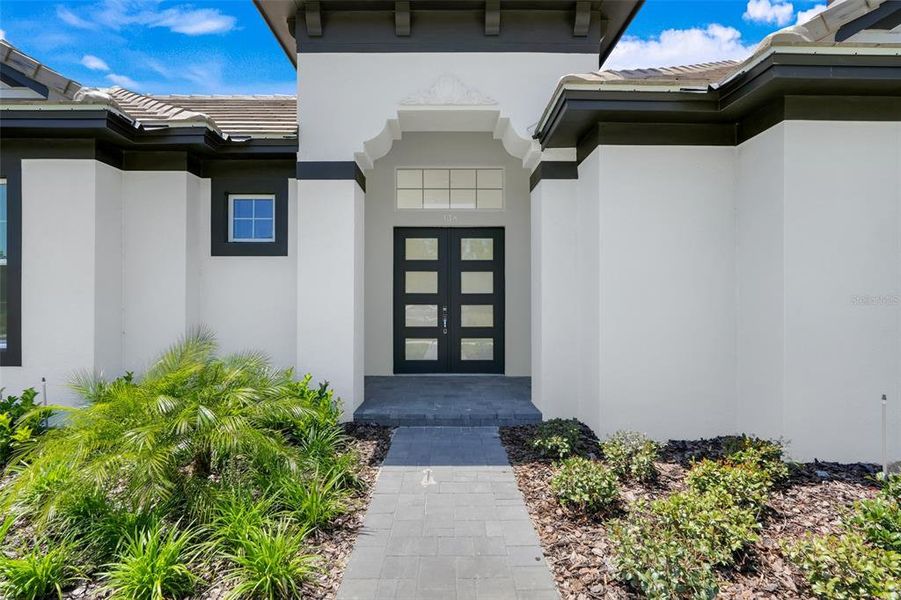 Exterior details and patio area of a home in Toscana, Palm Coast (Image 1).