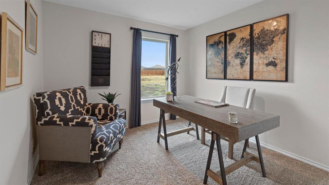 Office with baseboards and light colored carpet