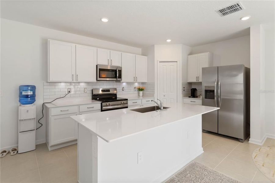 Furnished interior view inside a new home in Peace Creek Reserve: Manor Key Collection, Winter Haven (Image 12).