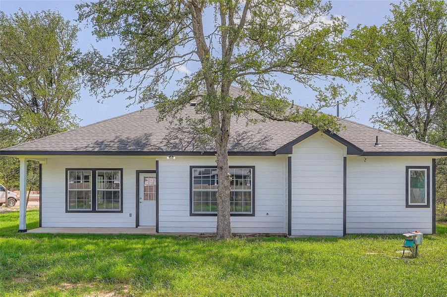 Rear view of back property and yard