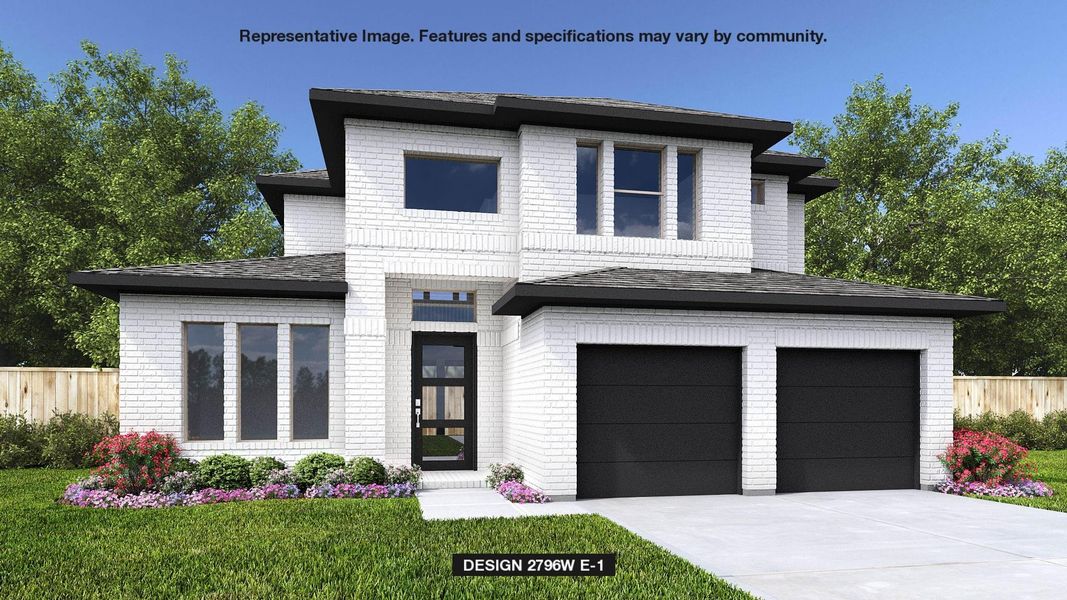 View of front of house with a garage and a front yard