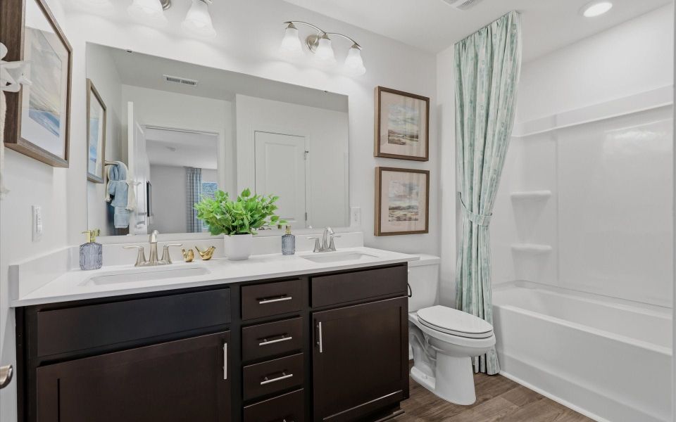 Representative furnished interior of a home built from the The Waterlily by Chesapeake Homes in Riverwalk Pointe at Mallory Creek - Townhomes, Leland (Image 20). Representative furnished interior of a home built from the The Waterlily by Chesapeake Homes in Riverwalk Pointe at Mallory Creek - Townhomes, Leland (Image 20).