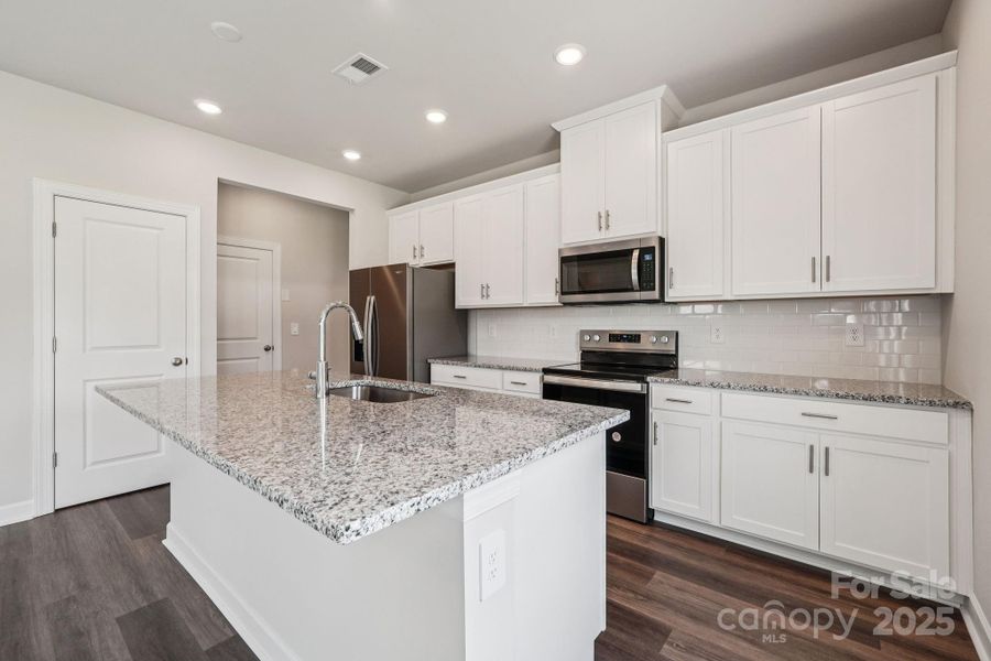 Photo is not of the actual home, but is an inspirational photo of builder’s model home and may depict options, furnishings, and/or decorator features that are not included