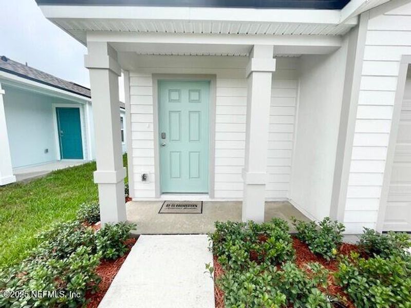 Exterior details and patio area of a home in Grand Reserve, Bunnell (Image 37).