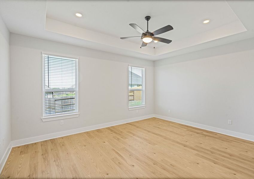 The master bedroom has two large windows that let in great, natural light. The master bedroom has two large windows that let in great, natural light.