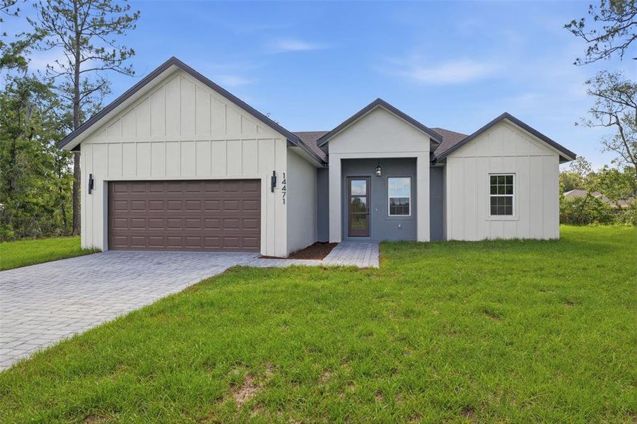 Front exterior of a new home in , Ocala, FL, highlighting curb appeal (Image 1). Front exterior of a new home in , Ocala, FL, highlighting curb appeal (Image 1).