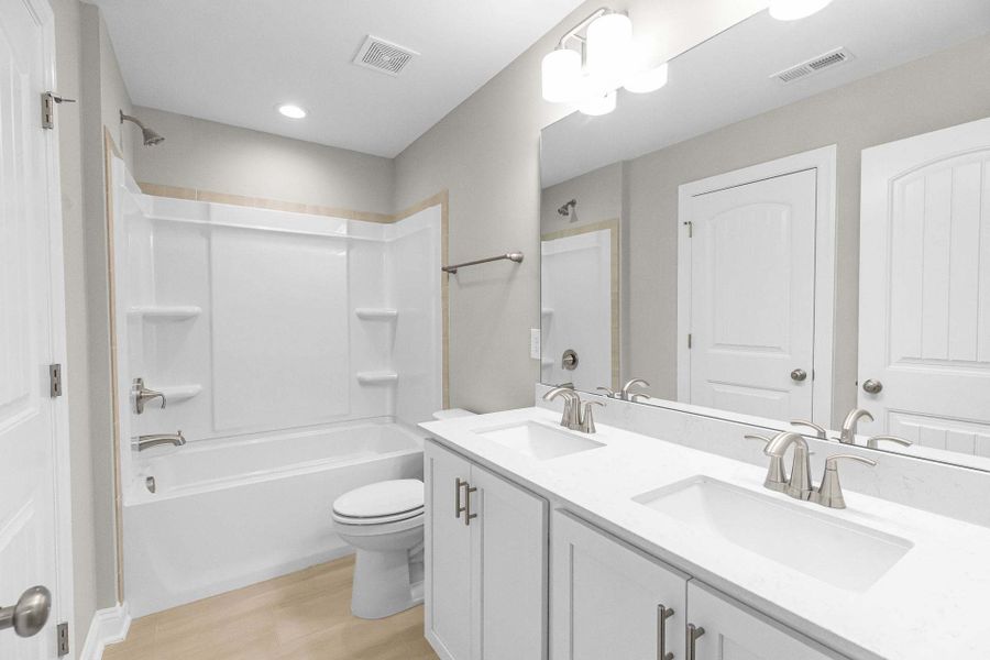 Representative furnished interior of a home built from the Magnolia by Caviness & Cates Communities in Bartlett Manor, Youngsville (Image 195).