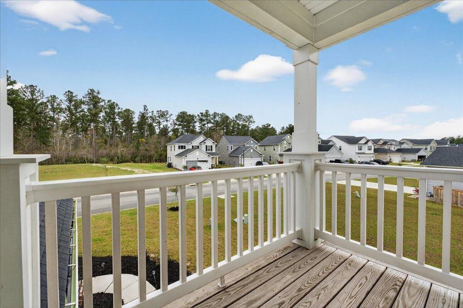 Exterior details and patio area of a home in Jasmine Point at Lakes of Cane Bay, Summerville (Image 4).